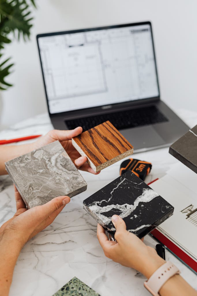 People Holding Tile Samples